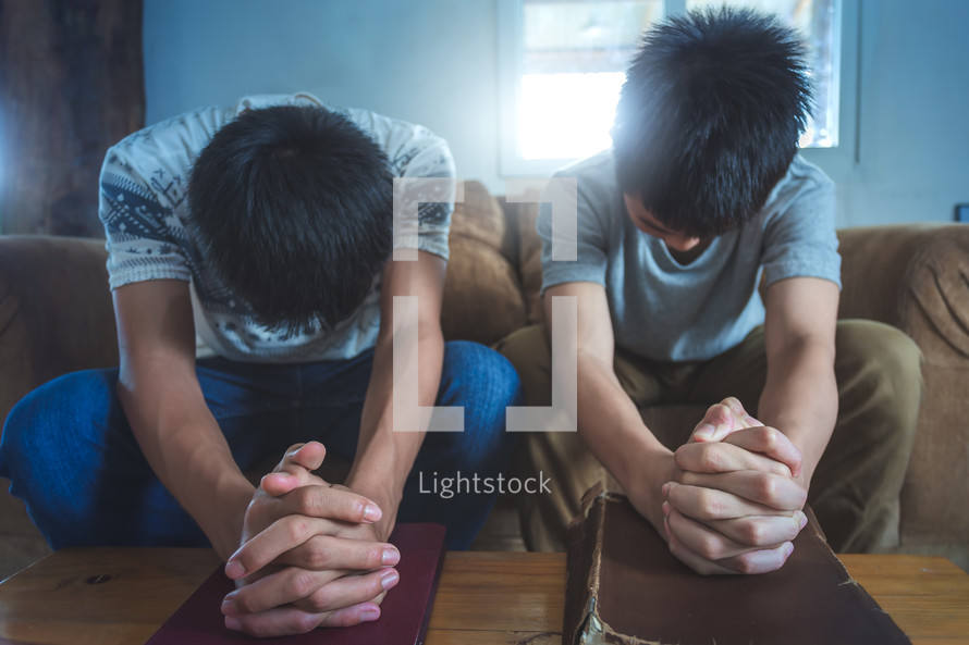 brothers praying together 