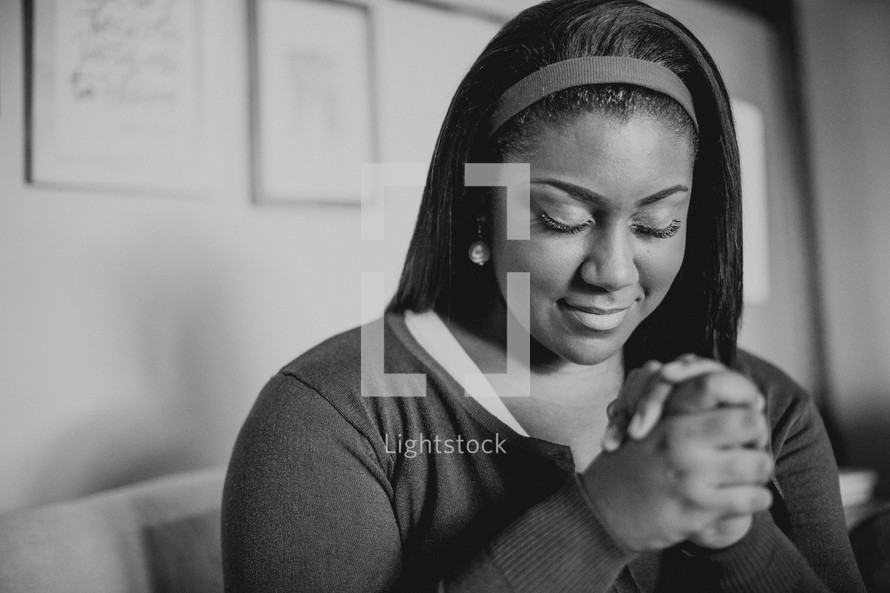 African-American woman with praying hands