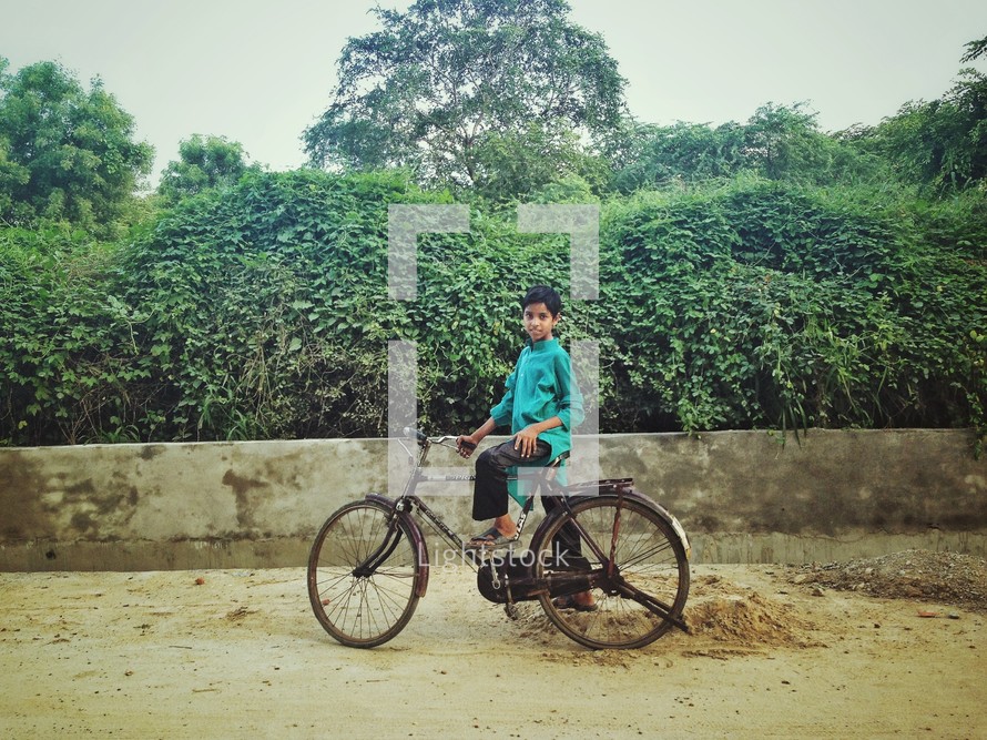 A child on a bicycle. 