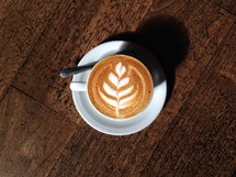 A leaf design in a cappuccino mug. 