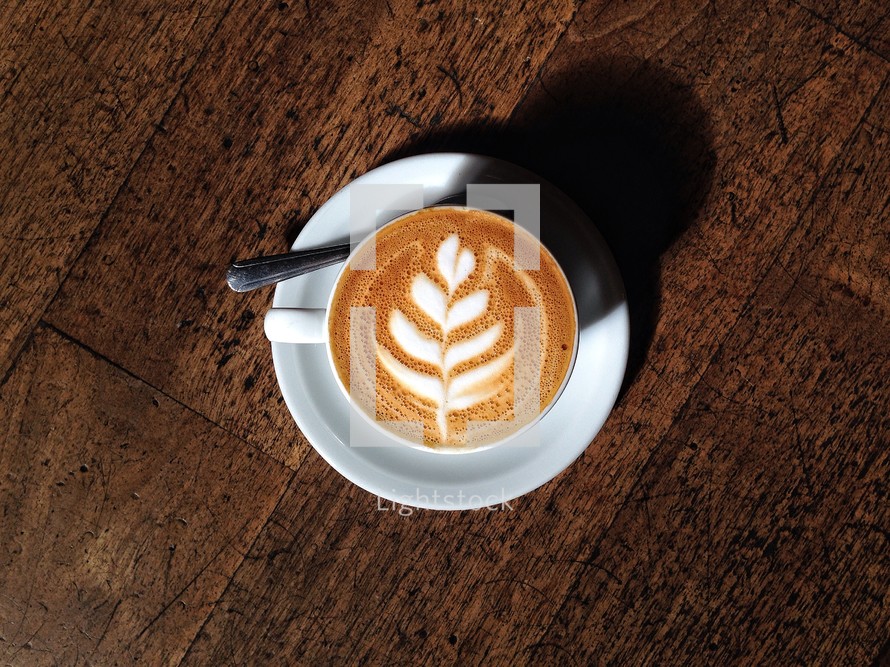A leaf design in a cappuccino mug. 