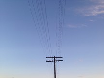 Power lines in the blue sky. 