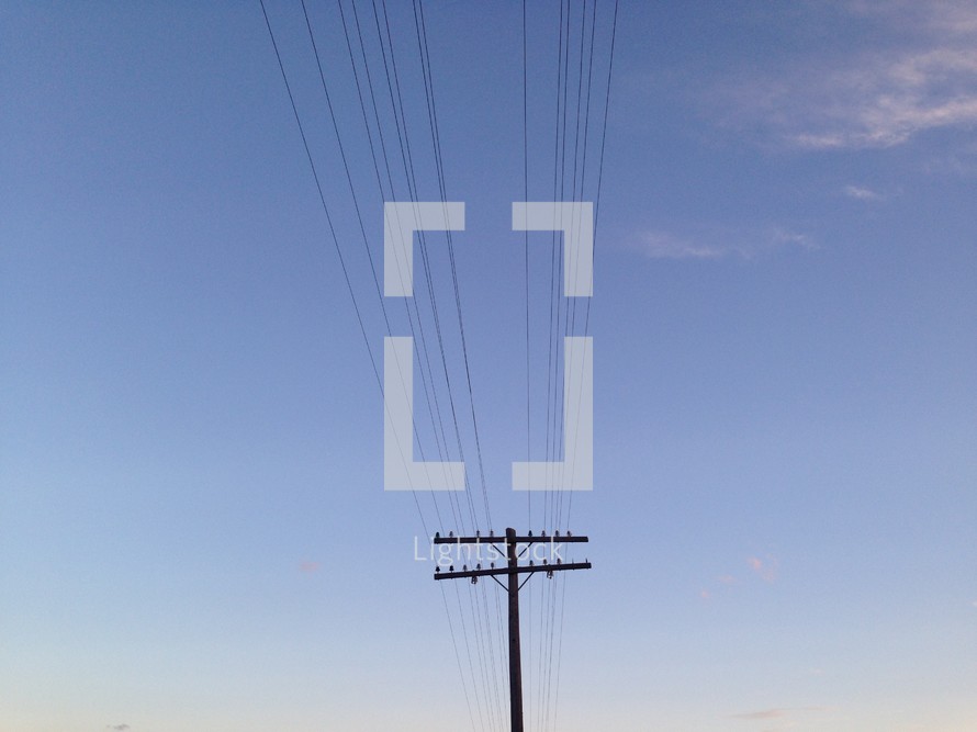 Power lines in the blue sky. 
