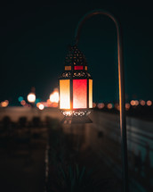 A lantern hanging on a night