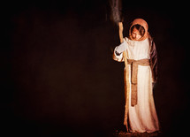 child in a Christmas pageant costume of Joseph 