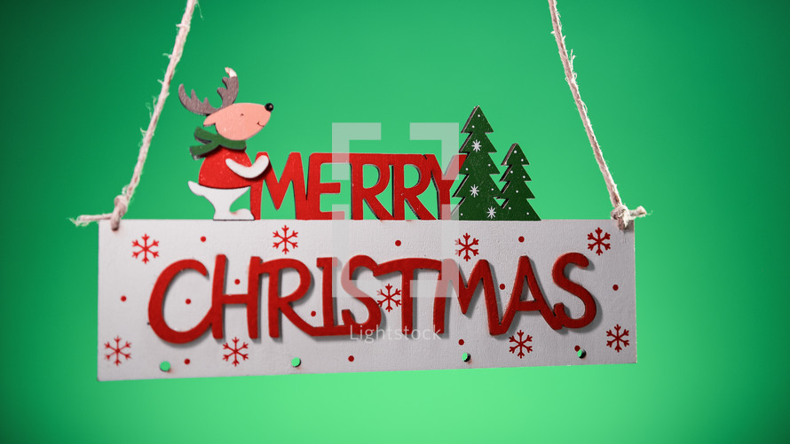 Merry Christmas sign decoration with green background