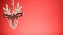 Reindeer Christmas decoration with red background