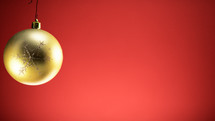 Christmas gold ball with red background