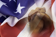 praying hands over a Bible and American flag overlay
