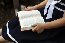 girl child reading a Bible