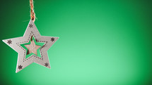 Star Christmas decoration with green background