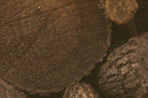Close up of a log in a stack of firewood