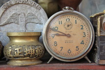 Alarm clock in antique shop window