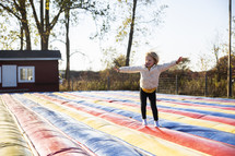 Girl playing on jumping toy
