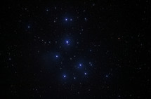 The iconic Pleiades star cluster in the evening sky