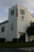 American flag on a flagpole on a church 
