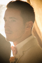 sunlight on the face of the groom 