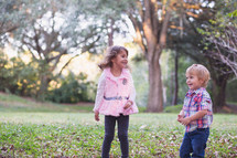 children playing outdoors in fall 