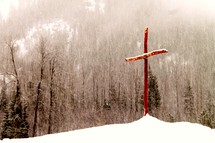 wood cross in the snow 