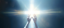 Hands raised towards luminous cross 