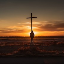 A man stands alone at a crossroads, bathed in the warm glow of the setting sun