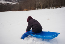 a child on a sled 