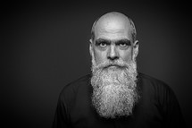 An image of a bearded bald man 