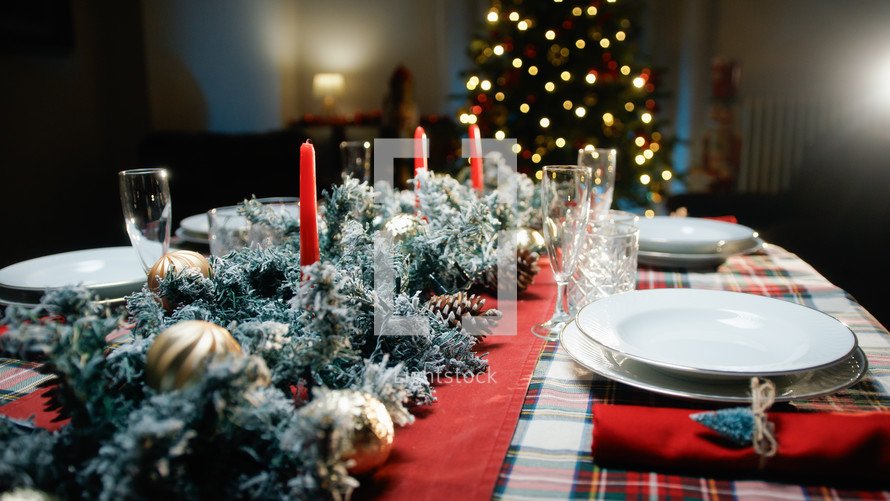 Set Christmas table for family dinner