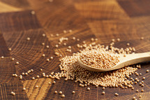 Pile of Mustard Seeds Isolated on a wood Background