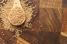 Pile of Mustard Seeds Isolated on a Wood Background