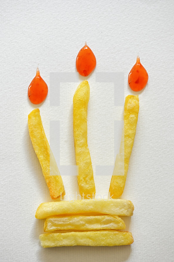Abstract Birthday Cake With Burning French Fries Candle