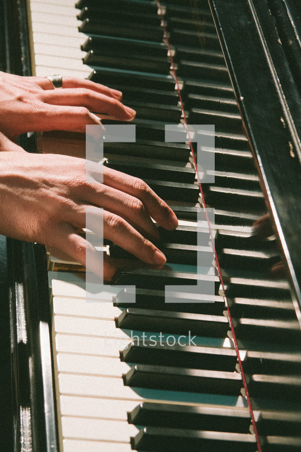 hands on piano keys 