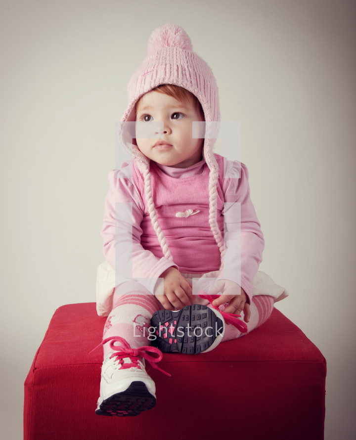 Portratit of baby with pink woolen hat