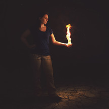 woman holding fire 
