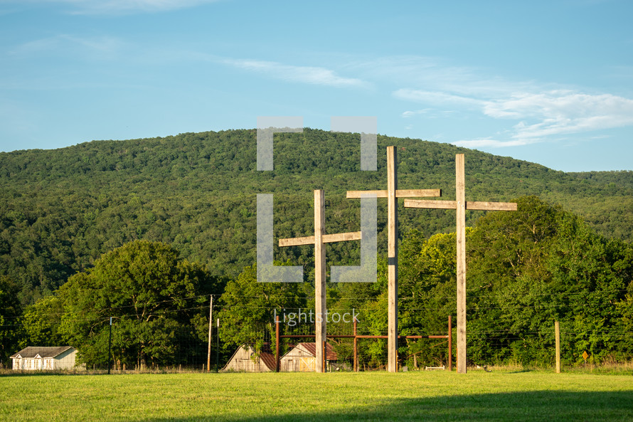 three crosses in a rural landscape 