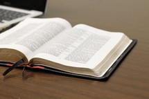 open Bible and laptop computer 