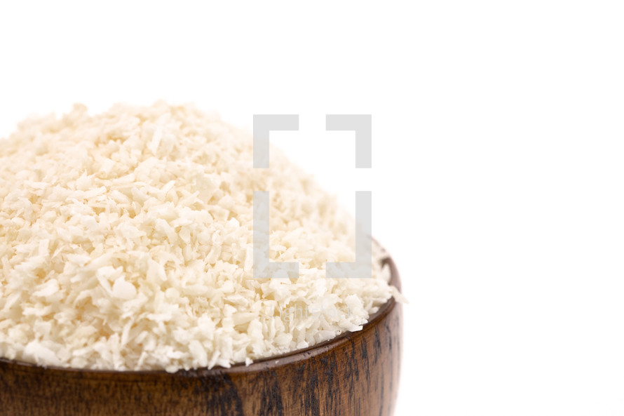 Raw Organic Unsweetened Coconut on a White Background