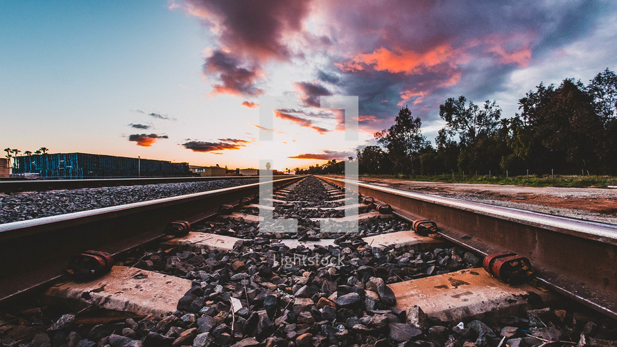 train tracks at sunset 