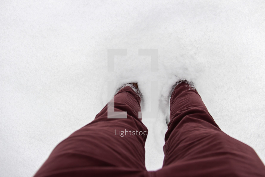legs standing in snow 