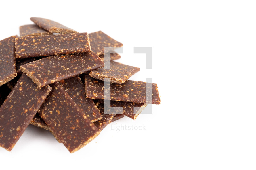 Pile of Beef Jerky for Dogs on a White Background
