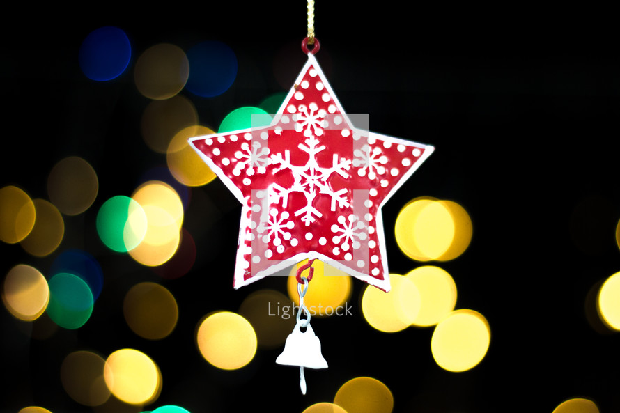 hanging star ornament and bokeh Christmas lights 