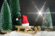 sleigh and bottle brush Christmas trees 