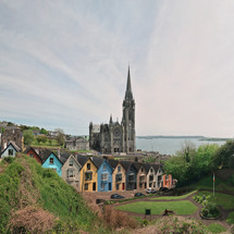 St. Colman's Cathedral And Colored Houses In Cobh, Ireland