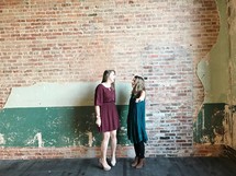 two friends talking in a warehouse 