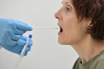 Doctor Collecting a nasopharyngeal nose and throat swab