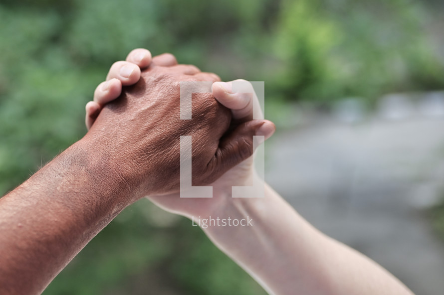 united, holding hands in friendship 