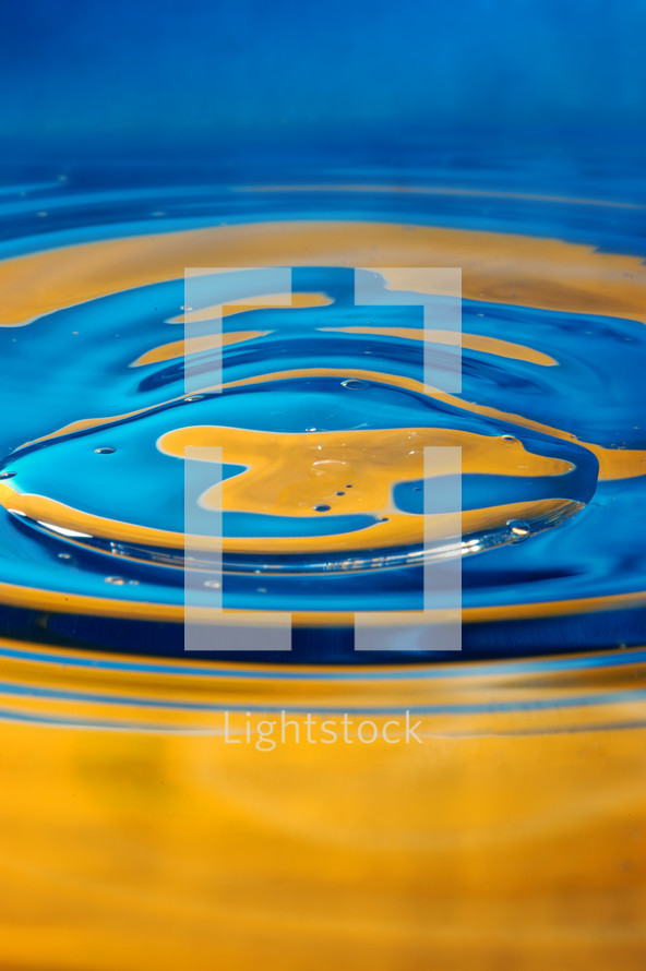 Close-up view on blue and yellow aquarelle paint like Ukrainian flag