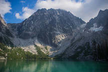mountain peak and a turquoise blue lake 