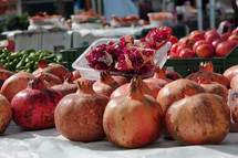 Red and ripe pomegranates in a sunny street market in the center of Ibiza Town
