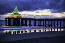 Christmas lights on a beach pier 